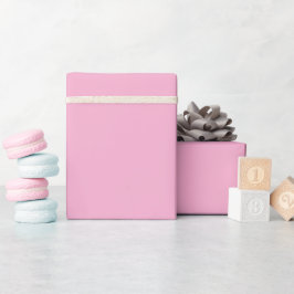 Een uniforme zachte roze achtergrond cadeaupapier