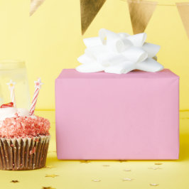 Een uniforme zachte roze achtergrond cadeaupapier