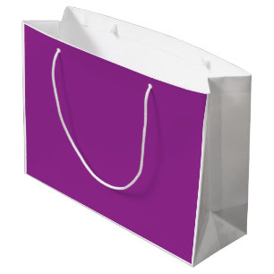 Een verloopachtergrond die tinten roze en groot cadeauzakje