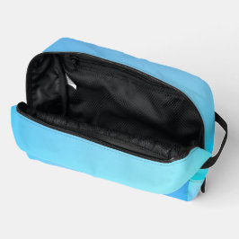 Een verloopzak met tinten blauw die vervagen toilettasje