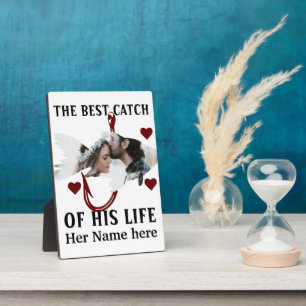 Een visser die een paar visfoto met geluk bijpast fotoplaat