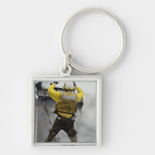 Een vliegtuig regisseur signaleert een F/A-18C Hor Sleutelhanger