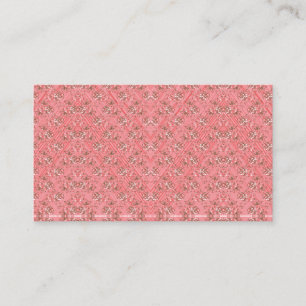 Een vloerkleed met een rood en roze motief heeft e visitekaartje