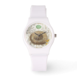 Een vogelnest met een groene eieren horloge