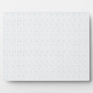 Een volledig wit, karakterloos oppervlak vult de fotoplaat