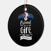 Een vriend is een cadeau. keramisch ornament (Links)