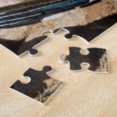 Een wegloper pauzeert tijdelijk op zijn onderzoek legpuzzel (Zijkant)