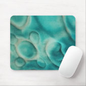 Een wervelend patroon in blauwgroen en lichtbeige muismat (Met muis)