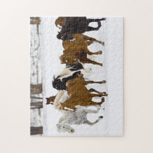 Een winters landschap van rennende paarden legpuzzel