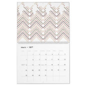 Een witte achtergrond met bruine en rode stippen kalender (Mar 2027)