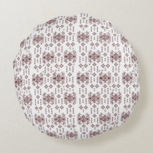 Een witte achtergrond met een rood patroon erop rond kussen