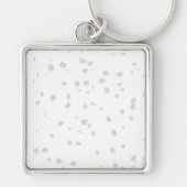 Een witte achtergrond met veel kleine stippen sleutelhanger (Voorkant)