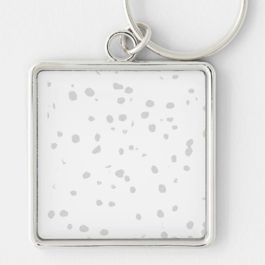 Een witte achtergrond met veel kleine stippen sleutelhanger (Voorkant)