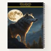 Een wolf huilt 's nachts onder een volle maan notitieboek (Achterkant)