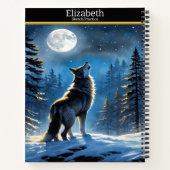 Een wolf zingt naar de maan op een winternacht notitieboek (Achterkant)