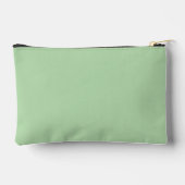 Een zachte bleke groene achtergrond vult de afbeel etui (Achterkant)