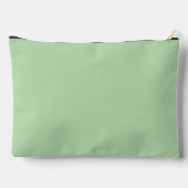 Een zachte bleke groene achtergrond vult de afbeel etui (Achterkant)