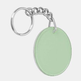 Een zachte bleke groene achtergrond vult de afbeel sleutelhanger