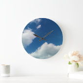 Een zachtheid aan de wolken grote klok (Huis)