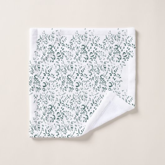 Een zilveren druppel spat in een poel van witte vl bad handdoek (Wasdoekje)