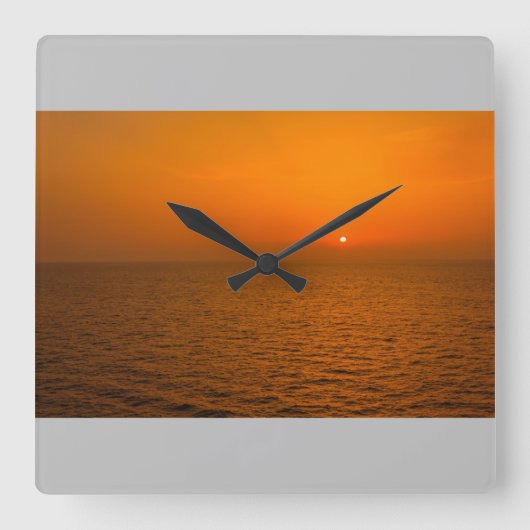 Een zonsondergang op zee op wandklok (Voorkant)