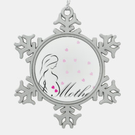 Een zwangere moeder met een miniatuur roze harten tin sneeuwvlok ornament