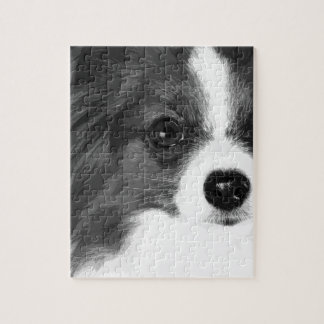 Een zwart-wit Papillon Legpuzzel