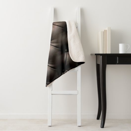 Een zwarte lederen kussenachtergrond, vanaf een au sherpa deken (In situ)