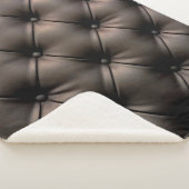 Een zwarte lederen kussenachtergrond, vanaf een au sherpa deken (3/4)