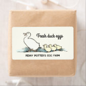 eend en eendjes vers ei karton label (Insitu)