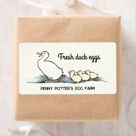 eend en eendjes vers ei karton label (Insitu)