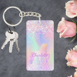 Eenhoorn roze paarse naam holografisch sleutelhanger<br><div class="desc">Een trendy holografische achtergrond met eenhoorn en pastelkleuren in roze,  paarse,  mintgroen. Versierd met faux glitter. Personaliseer en voeg jouw namen toe. Paarse letters. Een beetje alledaagse glamour om je dag op te fleuren!</div>