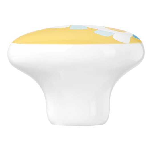 Eenhoorn speelt op het strand keramische knop (Zijkant)