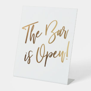 Eenvoudige Gold Handwriting Typografie De balk is  Reclamebord Met Voetstuk