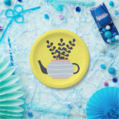 Eenvoudige moderne theepot met plant pastel papieren bordje (Feest)