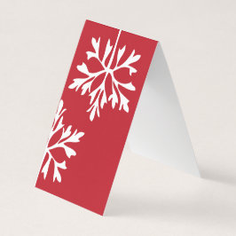 Eenvoudige sneeuwvlok op de rode achtergrond kaart