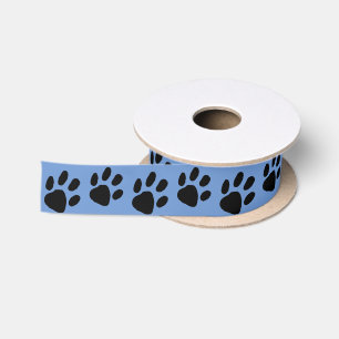 Eenvoudige zwarte poot print op blauw satijnen lint