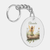 Eenzame fee Zittend op een Log Sleutelhanger (Voorkant Links)