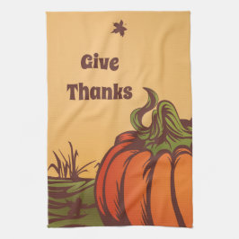 Eenzame pompoen op het veld. De herfst verlaat her Theedoek