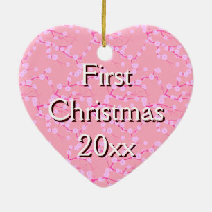 Eerste kerst Ornament op roze kersenbloesems