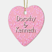 Eerste kerst Ornament op roze kersenbloesems (Links)