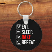 Eet. Slaap. Bak. Herhaal Sleutelhanger (Achterkant)
