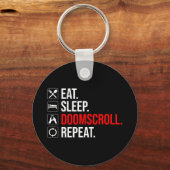 Eet. Slaap. Doomscroll. Herhaal Sleutelhanger (Achterkant)