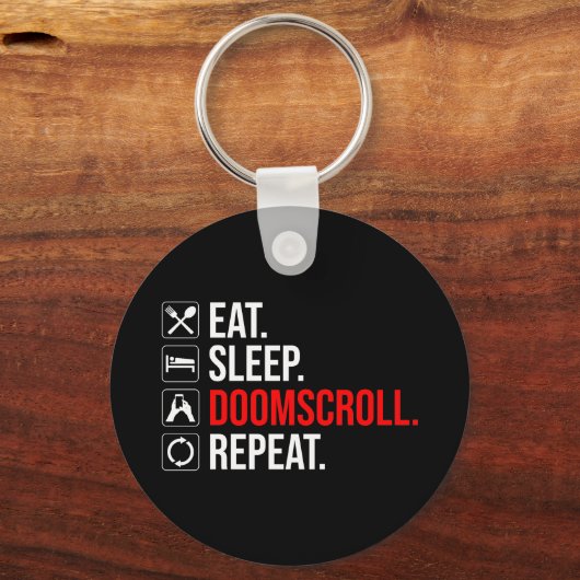 Eet. Slaap. Doomscroll. Herhaal Sleutelhanger (Voorkant)
