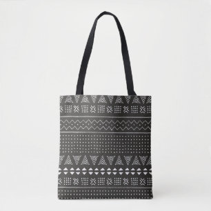 Eetnisch patroon van zwarte en witte stammen met g tote bag