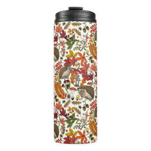Egels en herfst bosflora op ivoor thermosbeker