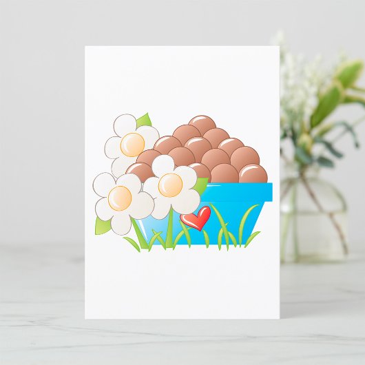 Eieren in blauwe kom met bloemen en hart kaart