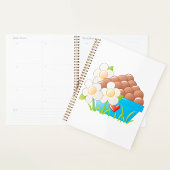 Eieren in blauwe kom met bloemen en hart planner