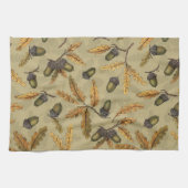 Eikels en eikenbladeren op ecru theedoek (Horizontaal)