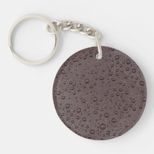 Eiwitbruine druppeltjes sleutelhanger
